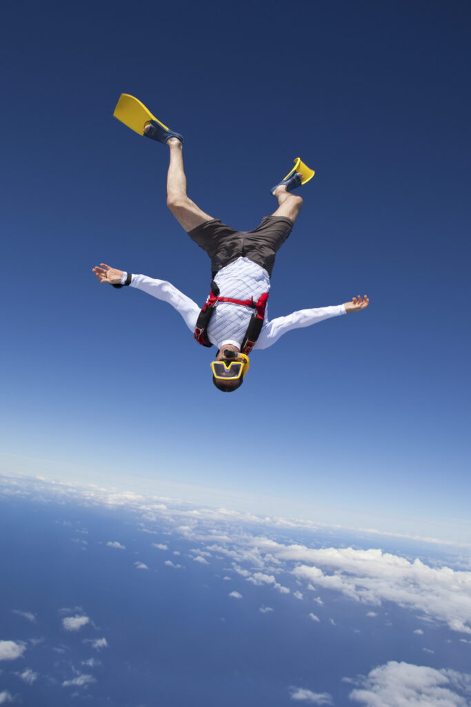 Skydiver in snorkel gear over north shore of Oahu, Hawaii